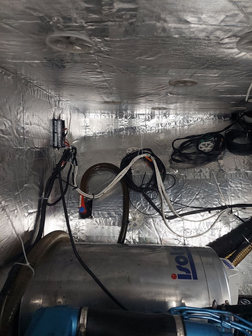 Marine-grade insulation installed in a boat engine compartment